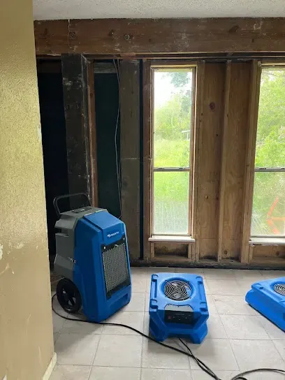 A wall opened to dry the cavity in a Forest Park, GA home