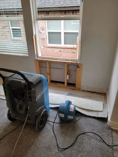 A dehumidifier running during structural drying in Forest Park, GA